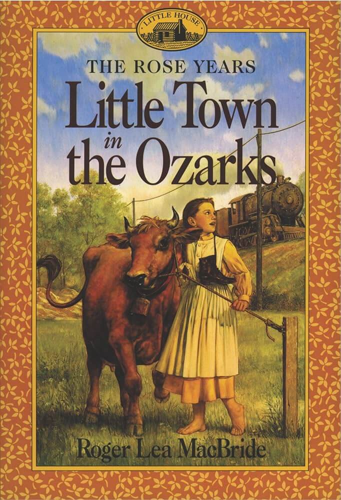 A girl leads a cow near a fence as a train passes in the background on the "Little Town in the Ozarks" book cover.